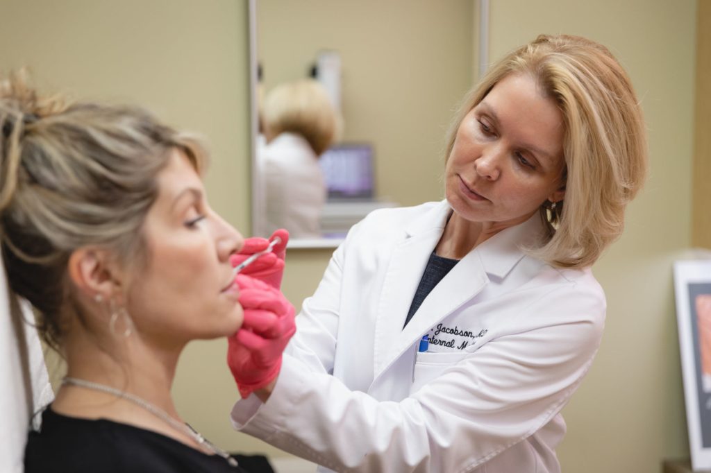 Dr. injecting fillers to a patient
